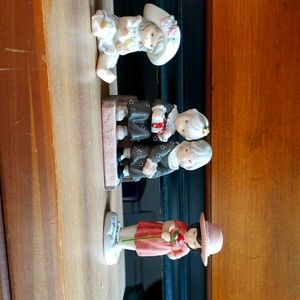 Set of three Kim Anderson figures.